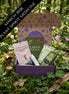 March Plant Spirit Medicine box with herbal tools, crystals, and nature-inspired ritual items.