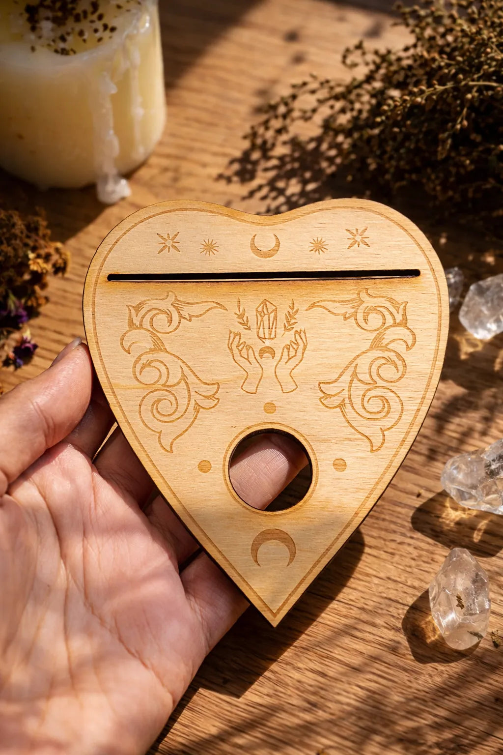 heart shaped planchette stand for holding oracle cards and crystal spheres in ritual space