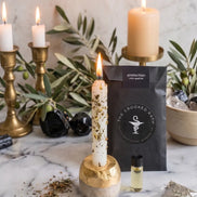 protection spell kit with candle, herbs, and ritual tools for spiritual protection