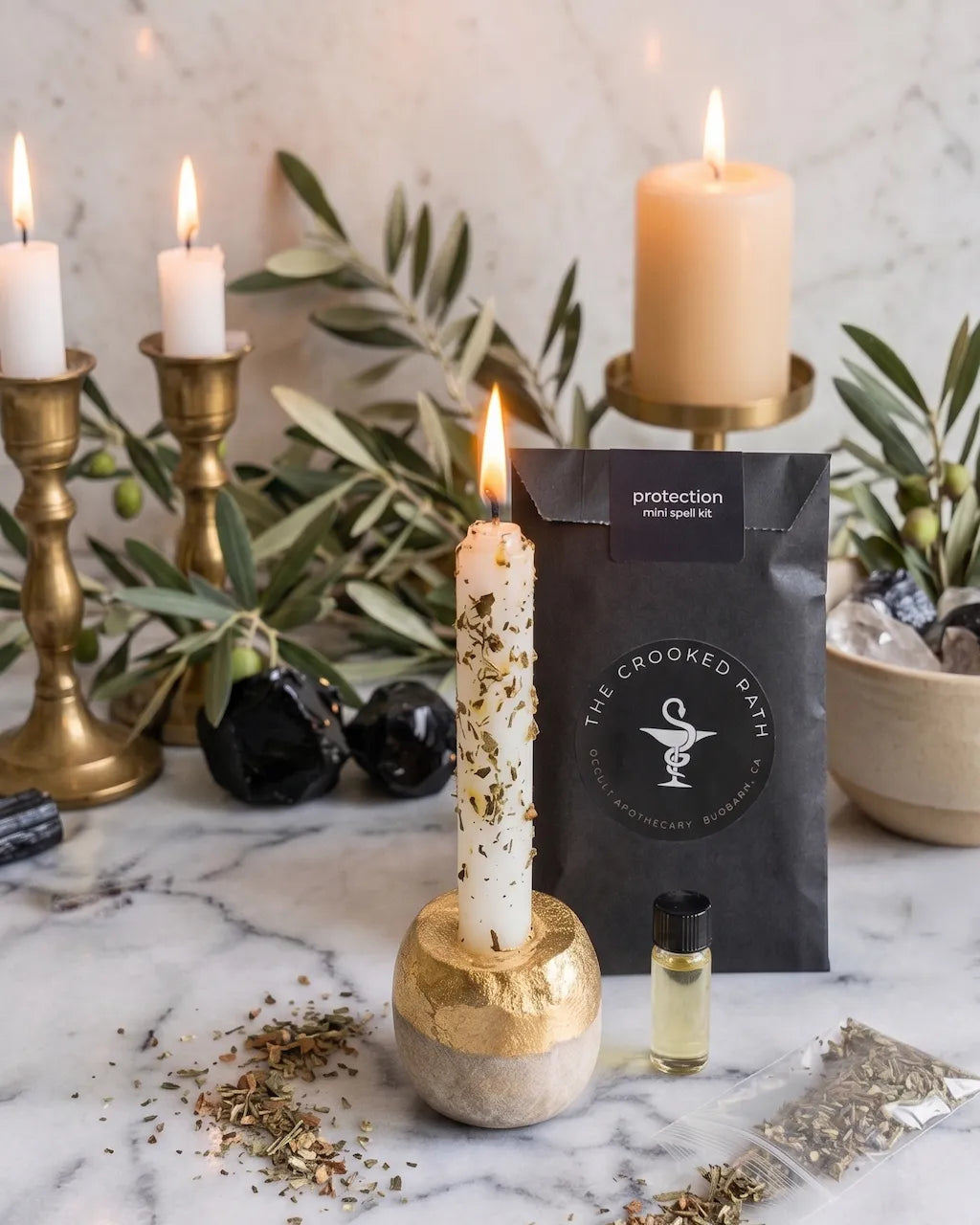 protection spell kit with candle, herbs, and ritual tools for spiritual protection