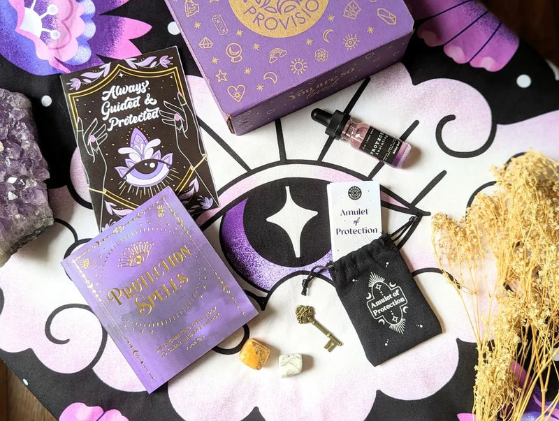Protection Goddess Provisions Box featuring crystals, ritual oil, protection book, and mystical spiritual tools.