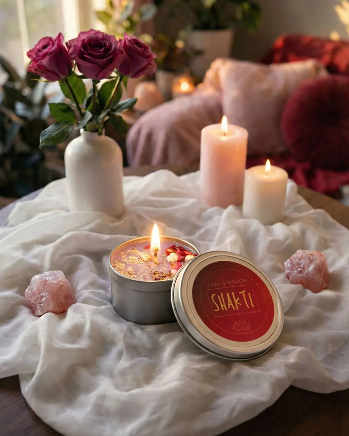 Shakti ritual candle adorned with gold leaf, rose, and jasmine for empowerment and divine feminine energy.