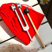 Stainless steel root chakra tuning fork engraved with I AM, designed for grounding and sound healing.