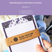 Positive review highlighting the compact size, recycled paper quality, and magical aesthetic of the notepad.