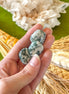 Tumbled Tree Agate crystal with natural green and white patterns for grounding energy.