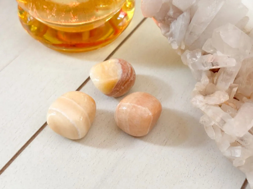 Yellow calcite tumbled stone used for positivity and inner light spiritual practice.