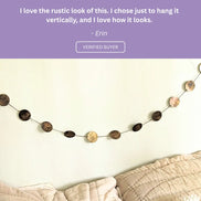 Five-star customer review praising the detailed zodiac artwork and quality craftsmanship of the wall hanging.