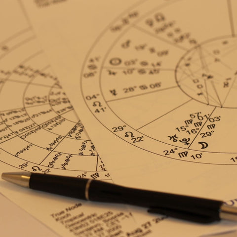 Astrology chart with a pen for Mercury Retrograde in An Astrologer’s Guide article