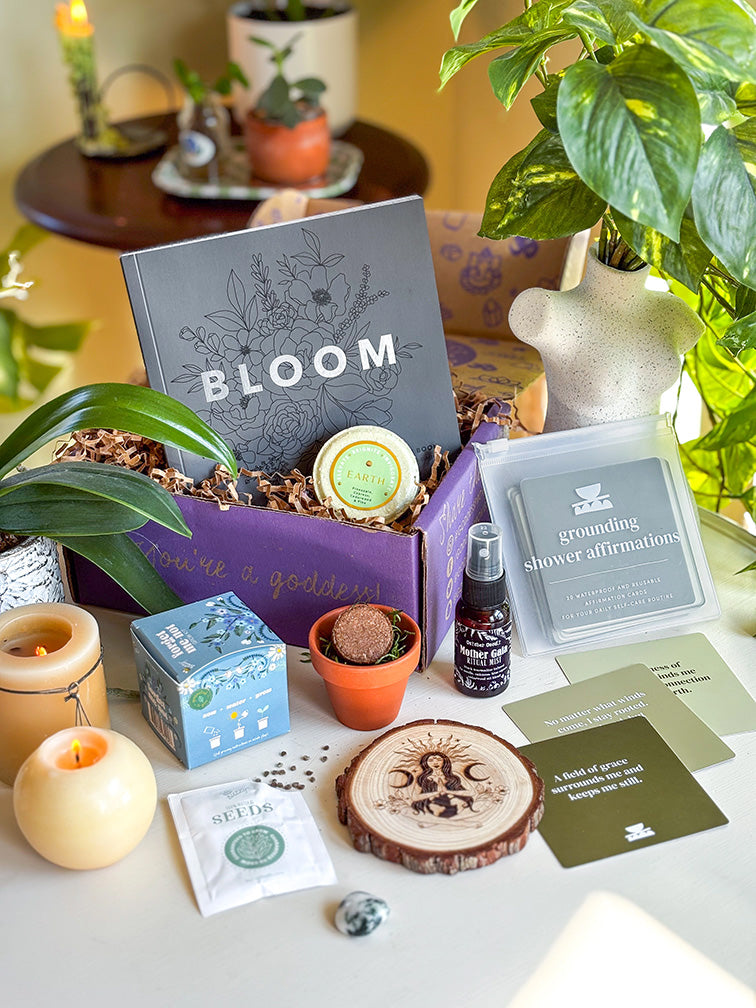 Goddess Box monthly spiritual subscription box with a Bloom ritual guide, crystals, a candle and ritual tools