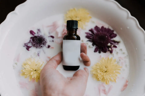Brown glass dropper bottle with blank white label for flower essence preparation