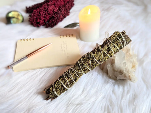 Bundled sage smudge stick with white string for Winter Solstice Ritual article