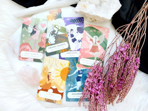 Colorful crystal-themed oracle cards displayed for magical guidance in an Oracle Trading Cards article