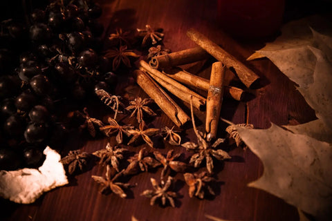 Dark berries, star anise, and cinnamon sticks for a cozy winter herbal guide