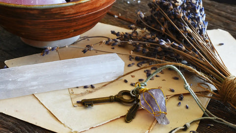 Mystical items including Selenite crystal Lavender bundle and Amethyst key for cleansing