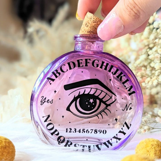 Cosmic Answers Glass Potion Bottle available at Goddess Provisions. Ideal for rituals, your altar, potions, and spellwork.