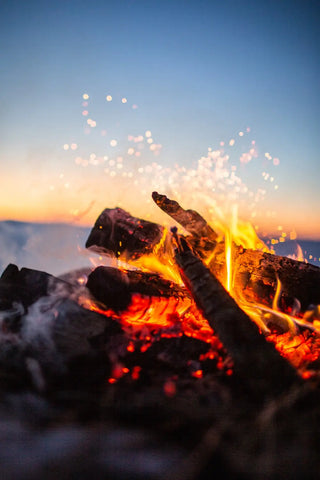 Campfire with glowing embers and bright flames for Release and Let Go Fire Ritual