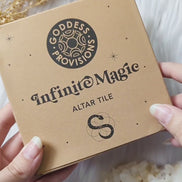 Video showcasing the Infinite Magic Altar Tile styled with candles, crystals, and ritual tools while highlighting the etched snake and Seed of Life design from different angles.