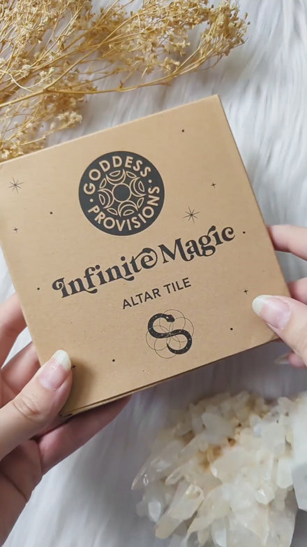 Video showcasing the Infinite Magic Altar Tile styled with candles, crystals, and ritual tools while highlighting the etched snake and Seed of Life design from different angles.
