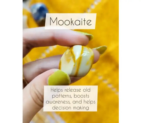 Smooth polished Mookaite tumble stone with creamy white and mustard yellow stripes