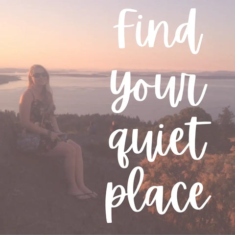 Woman in floral dress sitting outdoors with scenic view for Self-Guided Retreats article
