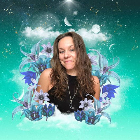 Woman with long brown hair, black top, crescent moon necklace among blue flowers and stars