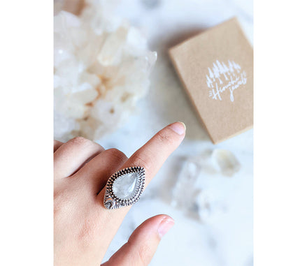 Adjustable antique silver-plated brass Clear Quartz Moonlight Ring featuring a crescent moon and crystal design. Available at Goddess Provisions