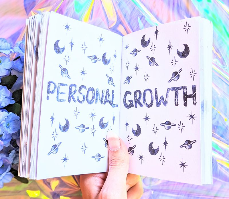 Dreamy moons manifest workbook featuring journal prompts and vision boards. Available at Goddess Provisions