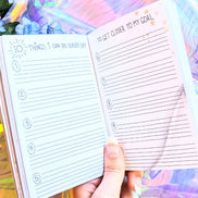Dreamy moons manifest workbook featuring journal prompts and vision boards. Available at Goddess Provisions