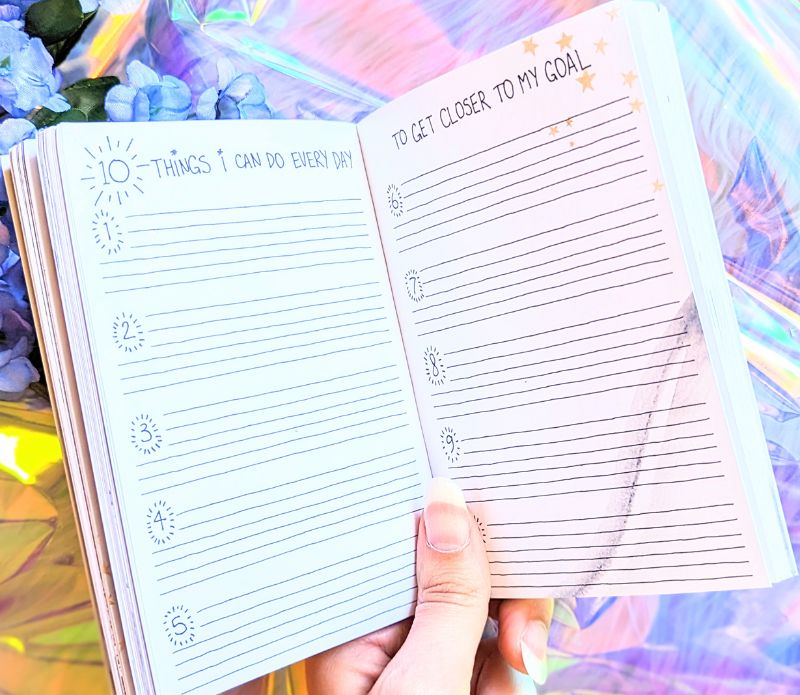 Dreamy moons manifest workbook featuring journal prompts and vision boards. Available at Goddess Provisions