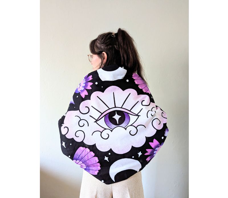 Mystic Moons Drape used as an altar cloth with lunar symbolism. Versatile Mystic Moons textile for altars, decor, or wearing. Available at Goddess Provisions.