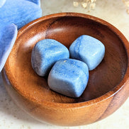 The tumbled Dumortierite is a high-vibration crystal for enhancing intuition, activating the third eye chakra, and connecting with higher realms. Available at Goddess Provisions.