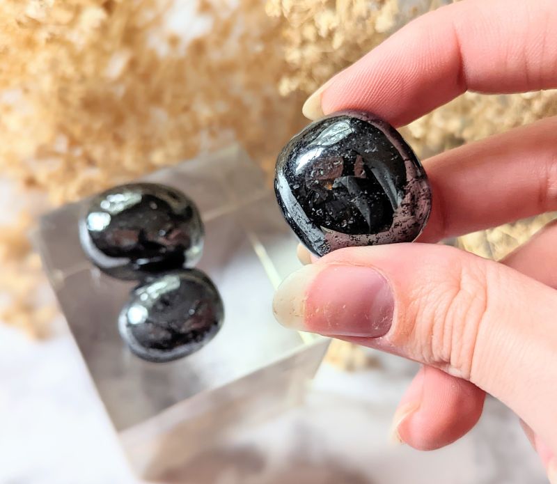 Ground your energy with Tumbled Hematite. This crystal connects to the root chakra, promoting balance and protection. Ideal for crystal healing and energetic stability. Available at Goddess Provisions.