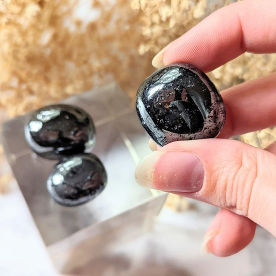 Ground your energy with Tumbled Hematite. This crystal connects to the root chakra, promoting balance and protection. Ideal for crystal healing and energetic stability. Available at Goddess Provisions.