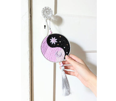 The Yin Yang Decorative Hanger is perfect for bedroom doors, drawer handles, or as wall decor. Available at Goddess Provisions