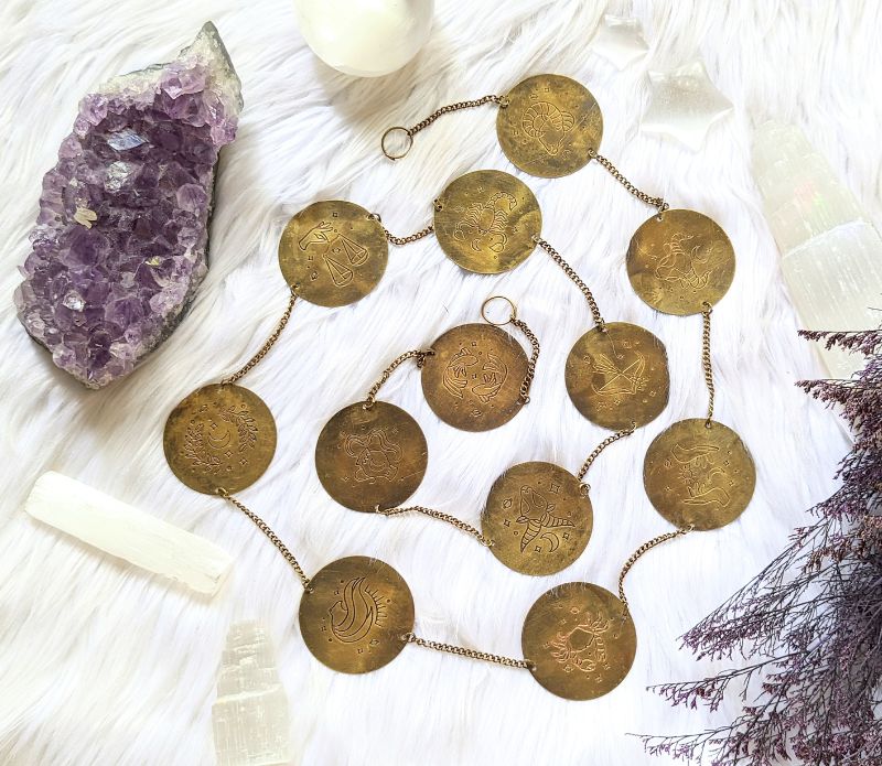 Discover the Zodiac Archetypes Wall Hanging, a celestial brass design showcasing all 12 zodiac signs. Perfect for altars, meditation spaces, or home decor, this astrology-inspired piece enhances your sacred space with star-guided wisdom. Available at Goddess Provisions