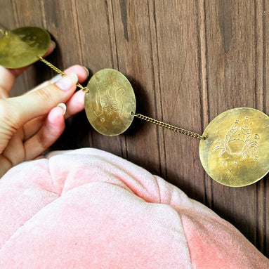 Discover the Zodiac Archetypes Wall Hanging, a celestial brass design showcasing all 12 zodiac signs. Perfect for altars, meditation spaces, or home decor, this astrology-inspired piece enhances your sacred space with star-guided wisdom. Available at Goddess Provisions