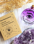 Cosmic Answers Glass Potion Bottle with packaging and crystals. Available at Goddess Provisions. Ideal for rituals, your altar, potions, and spellwork.