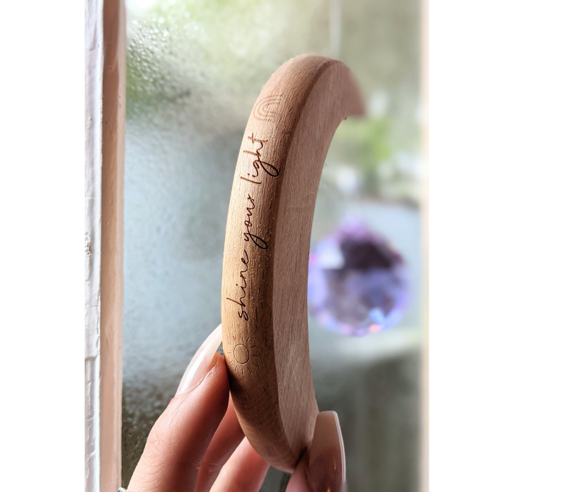 Crescent Moon Rainbow Maker. Made of wood and crystal. Available at Goddess Provisions