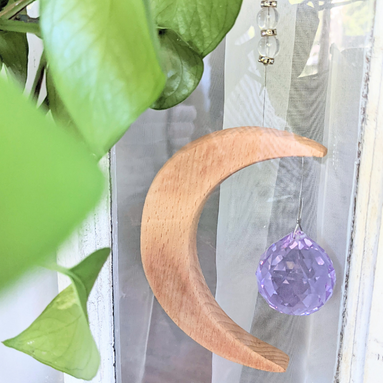 Crescent Moon Rainbow Maker. Made of wood and crystal. Available at Goddess Provisions