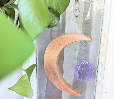 Crescent Moon Rainbow Maker. Made of wood and crystal. Available at Goddess Provisions