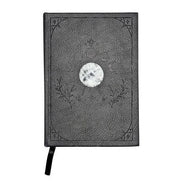 Mystical Musings Divination Diary showing a clear quartz crystal design surrounded by moon phases, ideal for amplifying dreams and manifestations.