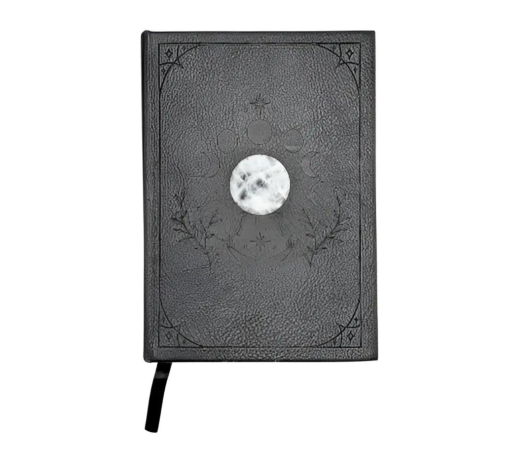 Mystical Musings Divination Diary showing a clear quartz crystal design surrounded by moon phases, ideal for amplifying dreams and manifestations.