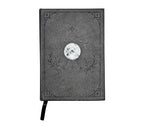 Mystical Musings Divination Diary showing a clear quartz crystal design surrounded by moon phases, ideal for amplifying dreams and manifestations.