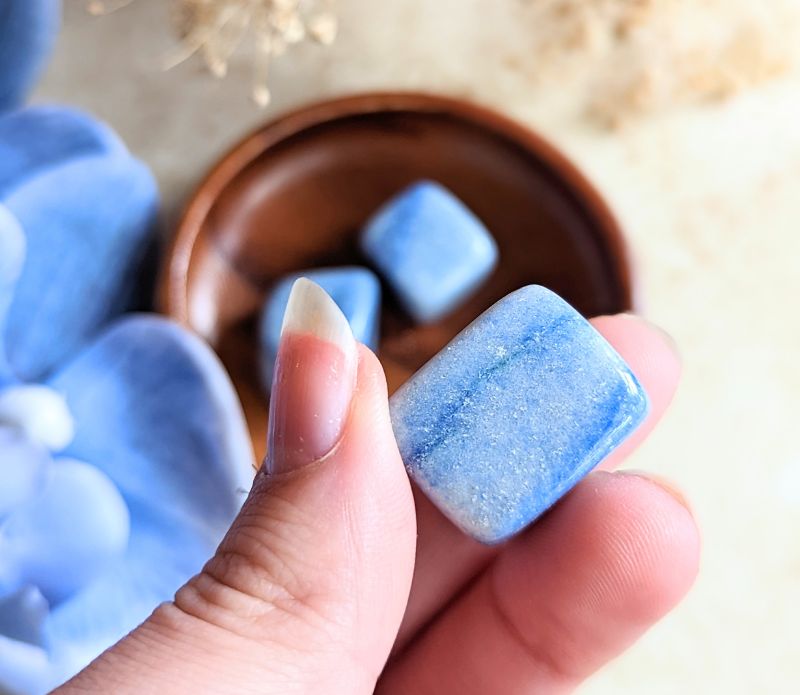 The tumbled Dumortierite is a high-vibration crystal for enhancing intuition, activating the third eye chakra, and connecting with higher realms. Available at Goddess Provisions.