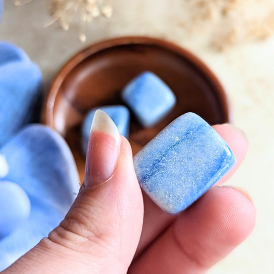 The tumbled Dumortierite is a high-vibration crystal for enhancing intuition, activating the third eye chakra, and connecting with higher realms. Available at Goddess Provisions.