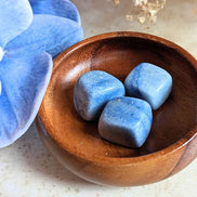 The tumbled Dumortierite is a high-vibration crystal for enhancing intuition, activating the third eye chakra, and connecting with higher realms. Available at Goddess Provisions.