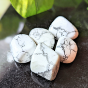Experience tranquility with the tumbled White Howlite. This soothing crystal supports emotional balance, patience, and spiritual growth, perfect for meditation and healing rituals. Available at Goddess Provisions.
