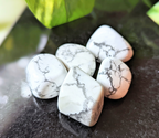 Experience tranquility with the tumbled White Howlite. This soothing crystal supports emotional balance, patience, and spiritual growth, perfect for meditation and healing rituals. Available at Goddess Provisions.