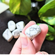 Experience tranquility with the tumbled White Howlite. This soothing crystal supports emotional balance, patience, and spiritual growth, perfect for meditation and healing rituals. Available at Goddess Provisions.